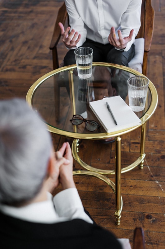 2 woman at table